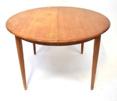 SKOVMAN & ANDERSEN; a mid 20th century Danish teak circular extending dining table on tapering legs,