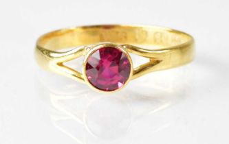 A 22ct yellow gold ring set with a ruby, size approx. N, approx. 1.8g. Condition Report: Shank is