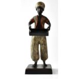 A contemporary painted cast metal figure of a young serving boy holding a tray, on square section