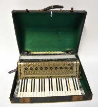 A cased Tonella piano accordion (af). Condition Report: One black key missing, with further losses