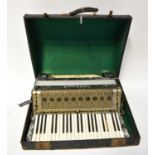 A cased Tonella piano accordion (af). Condition Report: One black key missing, with further losses