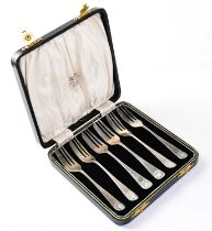 COOPER BROS & SONS LTD; a set of six George V hallmarked silver cake forks with shell finials,