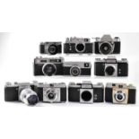 A quantity of vintage 35mm cameras to include Kodak Colorsnap 35, an Exa-IIB, Braun, Praktica FX,