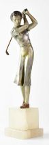 A painted spelter of a female golfer, raised on two-section stepped white hardstone base,