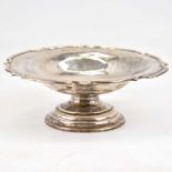 A George V hallmarked silver footed dish with scalloped edge, raised on pedestal, Chester 1911, 7