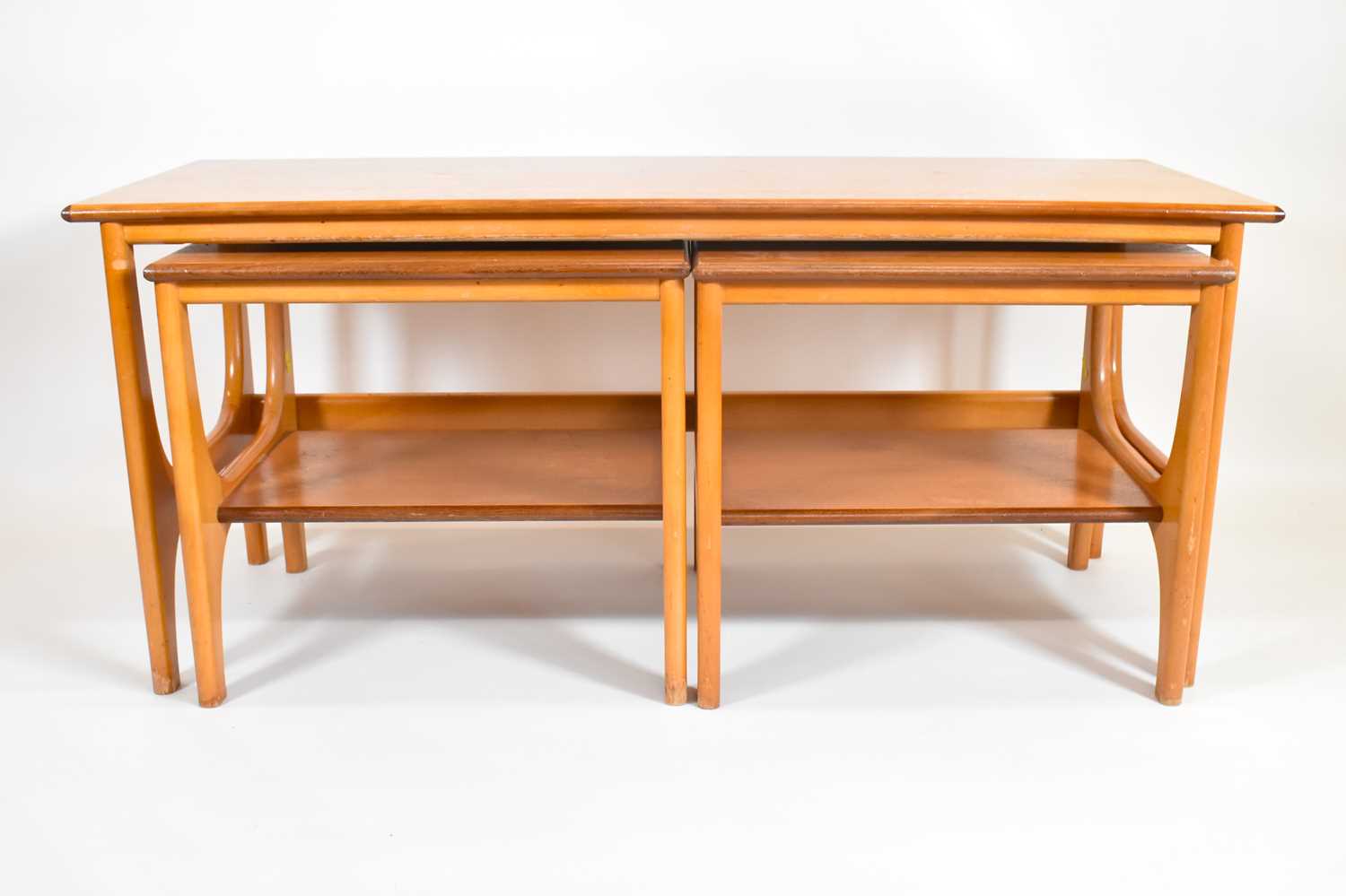 A nest of three 1960s/70s G-Plan style tables, one 46 x 100 x 44cm, and two 40 x 40 x 44cm.