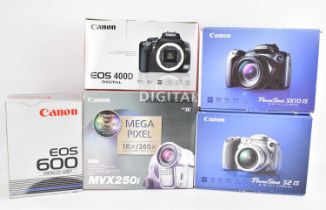 CANON; four boxed cameras comprising video camcorder MVX250i, a Powershot SX10 IS, a Powershot S215,