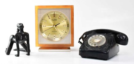 A vintage black Bakelite rotary telephone, a vintage Hi-Tron Tokyo Tokei acrylic cased clock, the