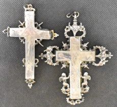 Two large silver crosses, height 10.5cm and 8cm, both engraved with image of Christ and in ornate