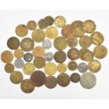 Various tokens and coins, many guinea-style brass gaming tokens, coins to include Victorian and some