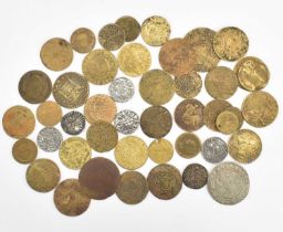 Various tokens and coins, many guinea-style brass gaming tokens, coins to include Victorian and some