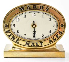 A reproduction brass advertising clock for 'Wards Fine Malt Ales', height 13cm. Condition