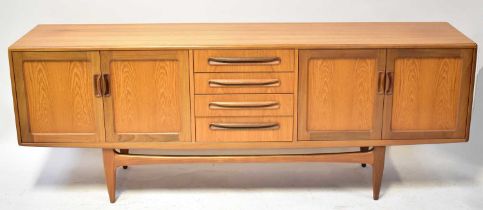 G-PLAN; a 1960s teak sideboard from the Fresco range, the central bank of four drawers flanked by