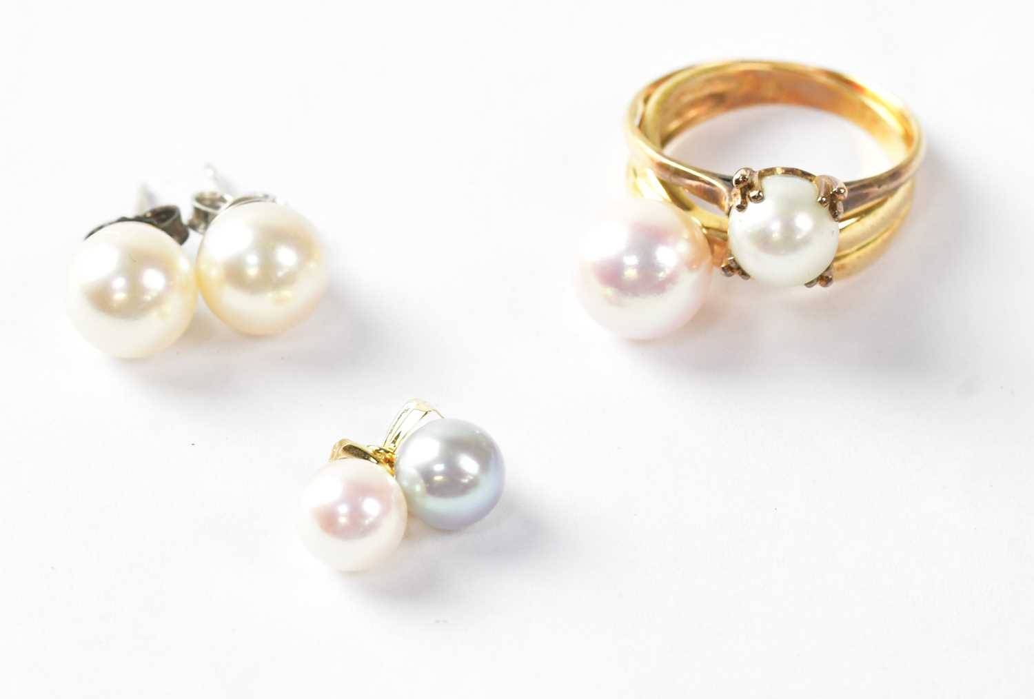 A collection of pearl set jewellery comprising two 18ct gold rings, both stamped K18, sizes K and Q,