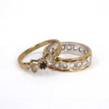 A 9ct yellow and white gold eternity ring set with white stones, and a 9ct gold dress ring with