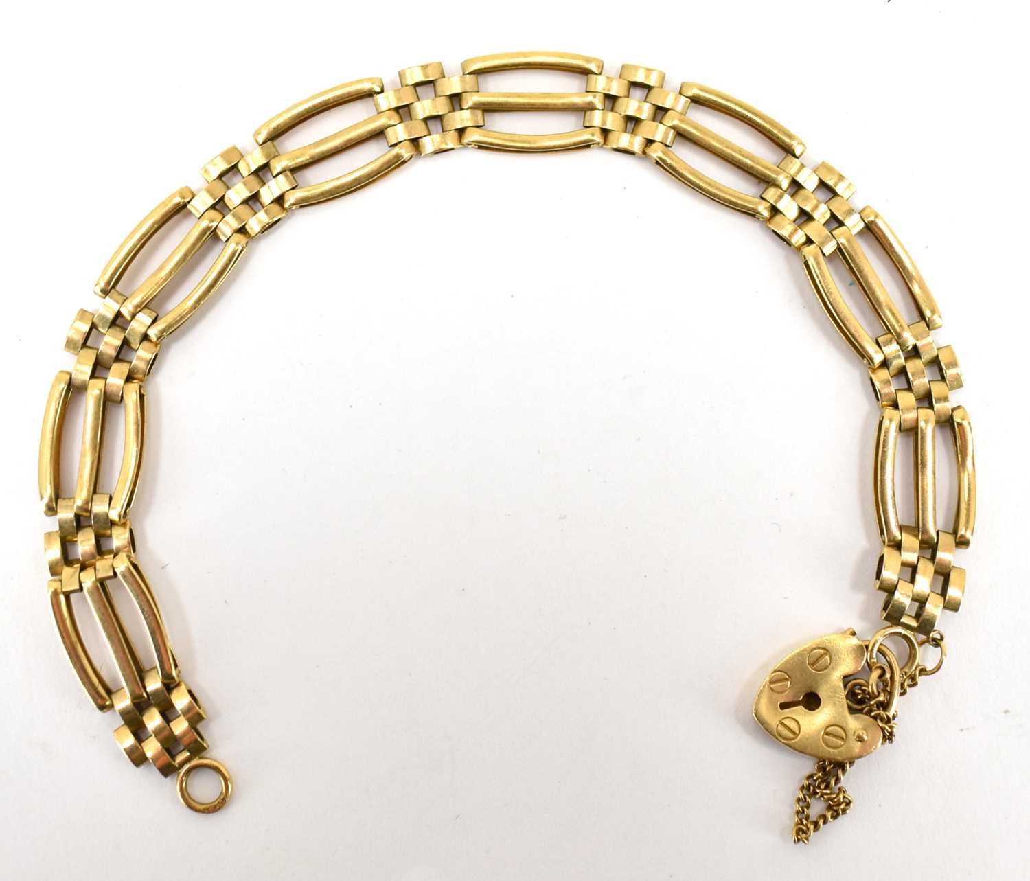 A 9ct gold three-bar link gate bracelet with 9ct gold heart-shaped padlock clasp, length 20cm,