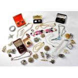 A quantity of vintage costume jewellery to include beaded necklaces, faux pearl necklaces, brooches,