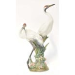 LLADRÓ; a 'Courting Cranes' figure group on naturalistic base, signed and dated 2.6.92 to the