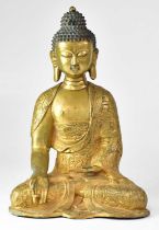 A gilded bronze figure of a seated Buddha, height 39cm. Condition Report: This figure does not sit