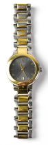 GUCCI; a two-tone stainless steel wristwatch, the dial set with Arabic numeral 12, baton numerals