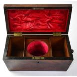 A Victorian flame mahogany line inlaid sarcophagus form tea caddy with three internal divisions,