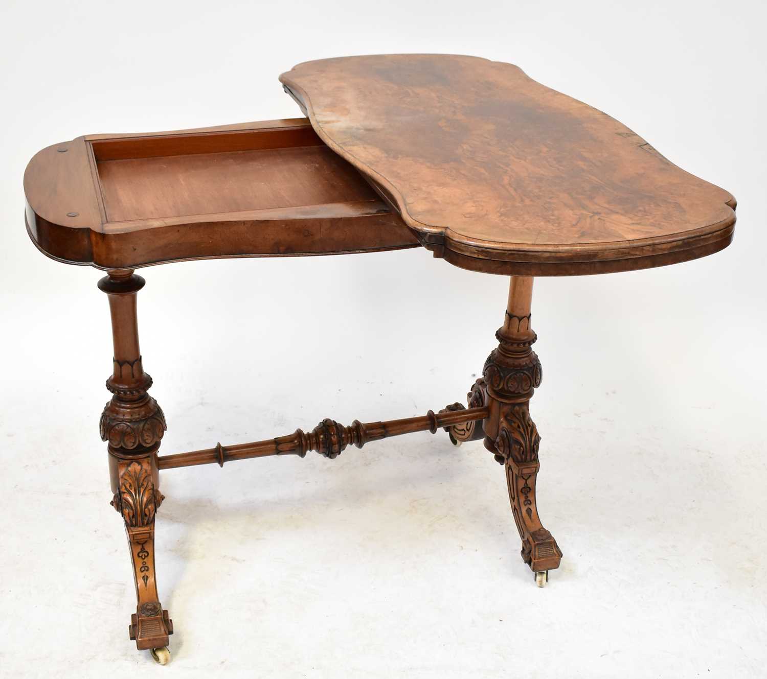 A burr walnut shaped fold-over card table raised on carved turned columns to stretchered outswept - Image 2 of 2