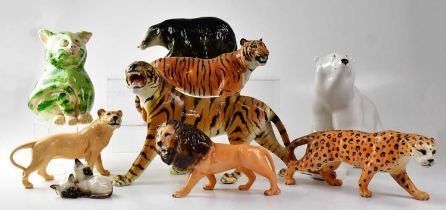 BESWICK; various big cats, comprising a tiger, a cheetah, a lion and lioness, a small figure group