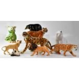 BESWICK; various big cats, comprising a tiger, a cheetah, a lion and lioness, a small figure group