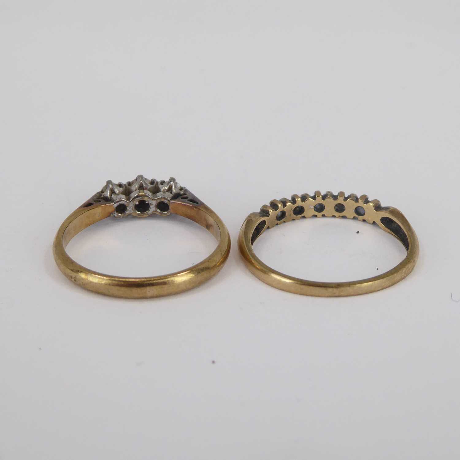 A 9ct gold ring with three small claw set graduated diamonds and a 9ct gold half eternity diamond - Image 4 of 4