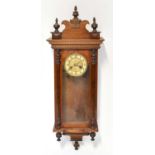 A mahogany cased spring-driven Vienna-style wall clock with twin drum movement striking on a gong,