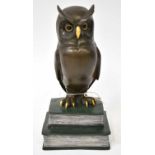 MANGREB; a bronze figure of an owl on two books with applied foundry token for Austria Bronze verso,