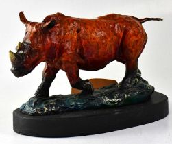 A contemporary painted bronze sculpture of a rhino, unsigned, height 21cm. Condition Report: -
