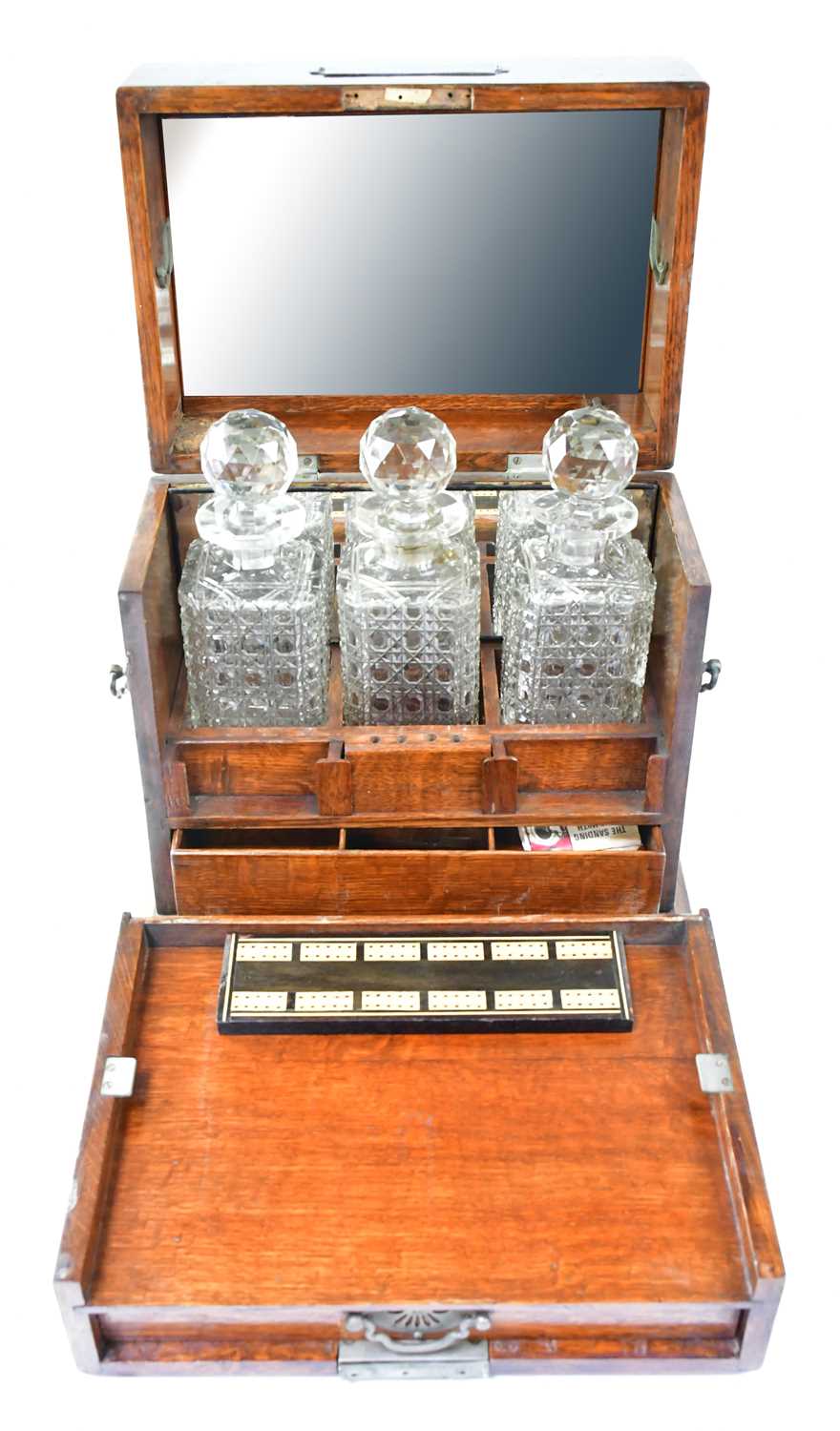 A late Victorian brass mounted oak cased tantalus and games compendium with three fitted glass - Image 2 of 2