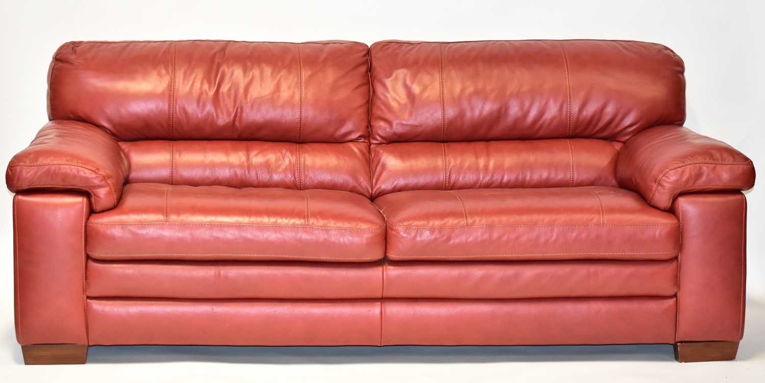 A large modern red leather large sofa, 90 x 226 x 94cm. Condition Report: With fire label