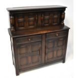 ERCOL; a dark stained elm court cupboard, 127 x 121.5 x 46cm.