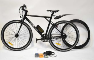 A Free Go Raptor electric bicycle in black livery, with charger and four spare tyres. Condition