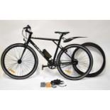 A Free Go Raptor electric bicycle in black livery, with charger and four spare tyres. Condition