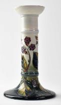 MOORCROFT; a 'Brambles' pattern candlestick on a blue, green and cream ground, impressed marks,