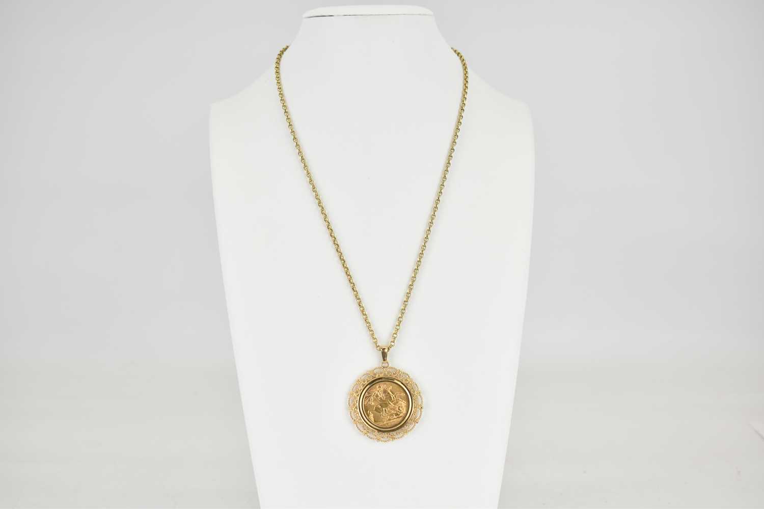 A George V 1925 full sovereign in a 9ct gold circular pendant mount with open scrollwork, - Image 2 of 3