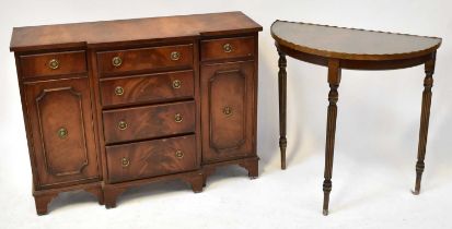 A reproduction mahogany crossbanded breakfront side cabinet, with four graduated drawers flanked