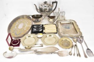 A three-piece silver plated tea set, a toast rack, various trays and dishes, a cased set of five