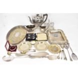 A three-piece silver plated tea set, a toast rack, various trays and dishes, a cased set of five