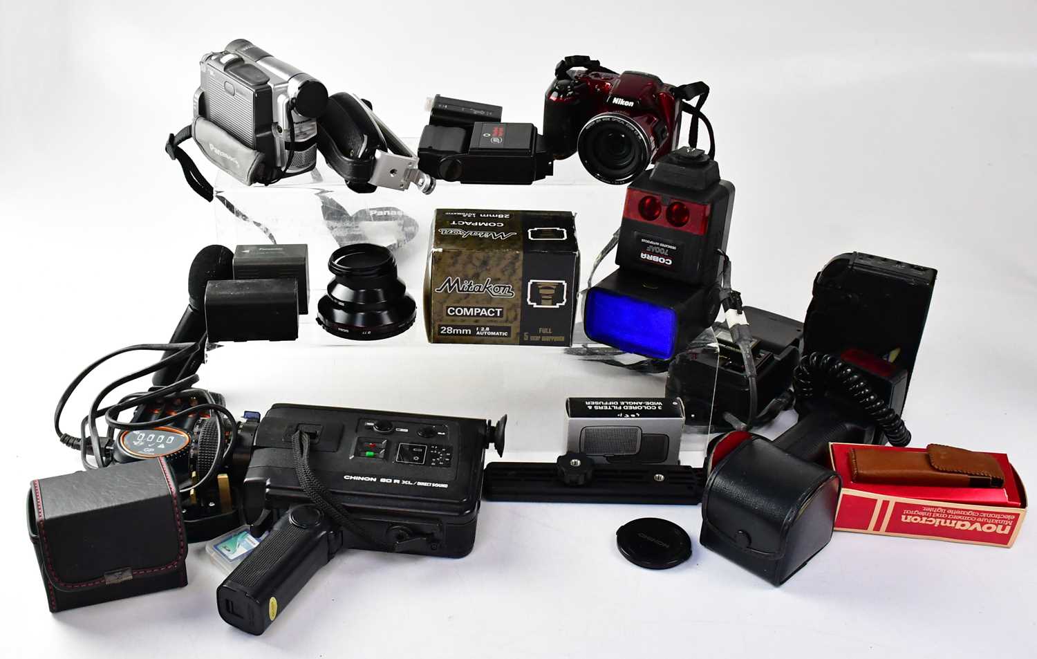 A quantity of vintage hand-held video cameras to include a Chinon 60RXL, various accessories, leads,