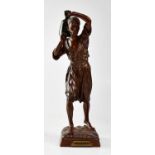 AFTER LOUIS AUGUSTE HIOLIN; a bronze figure of a Moorish water carrier holding a water jar on his