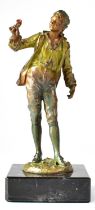 AFTER ERNEST RANCOULET (1842-1915); a cold painted bronze figure of a young man holding a flower,