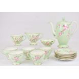 FOLEY CHINA; a fifteen-piece tea set decorated with apple blossoms on a pale green and white ground,