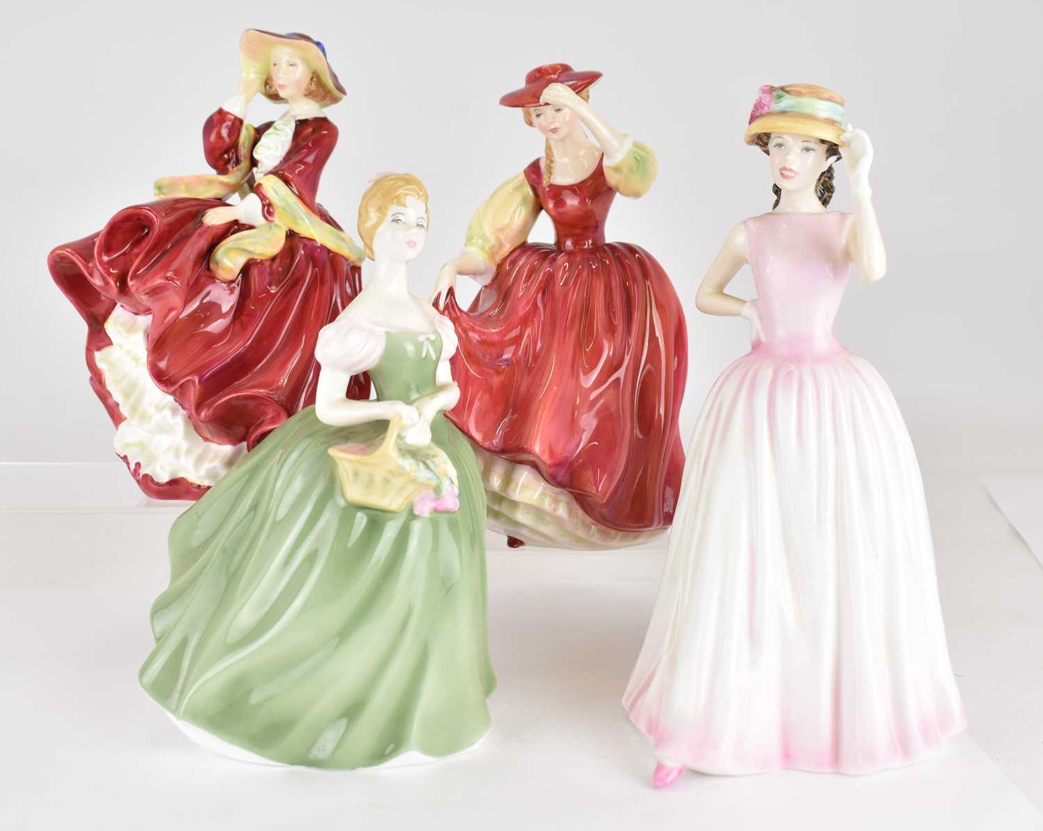 ROYAL DOULTON; four porcelain figurines comprising HN1834 'Top o' the Hill', height 18cm, HN2399 '