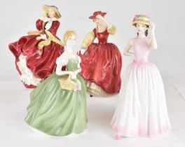 ROYAL DOULTON; four porcelain figurines comprising HN1834 'Top o' the Hill', height 18cm, HN2399 '