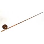 A substantial split cane brass mounted two-piece fishing rod with 8" Bakelite reel, overall length