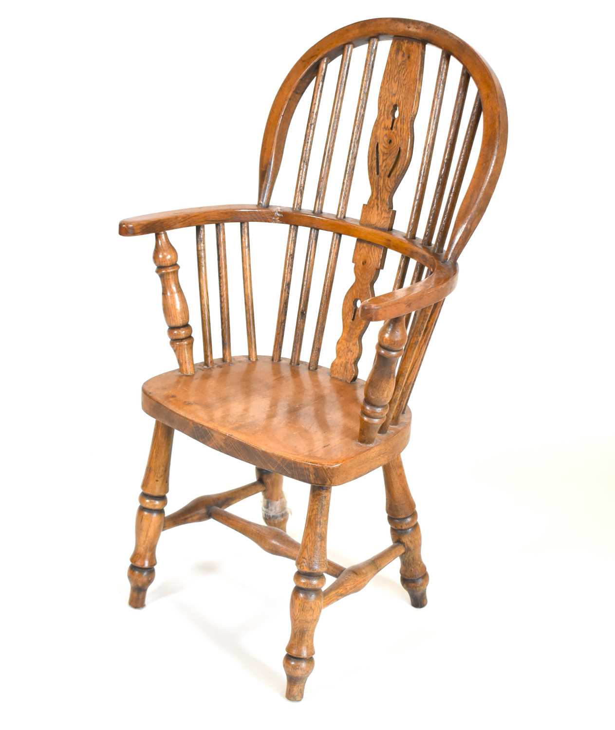 A children's oak stick back Windsor chair, with pierced back splat, 'H' cross stretcher, to turned